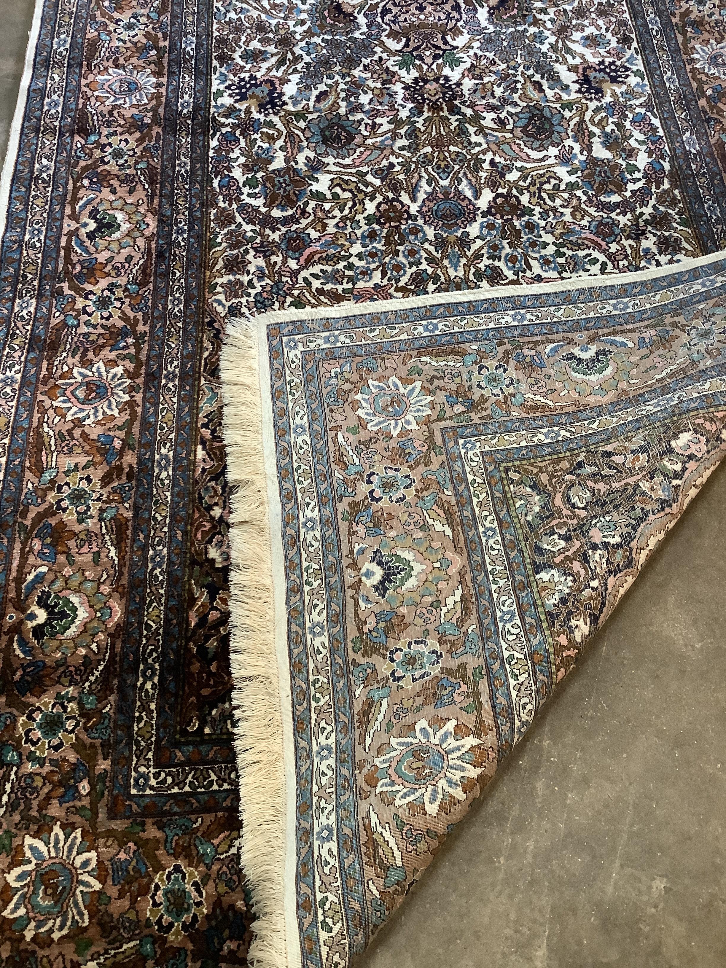 A North West Persian ivory ground rug, 220 x 136cm